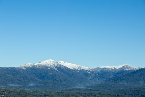 Landscape of snow-capped mountains in Sierra de Guadarrama National Park. Located in Segovia and Madrid, Spain