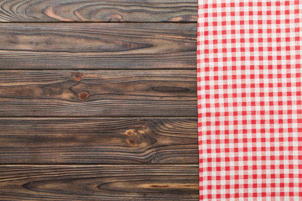 top view with red empty kitchen napkin isolated on table background. Folded cloth for mockup with copy space, Flat lay. Minimal style