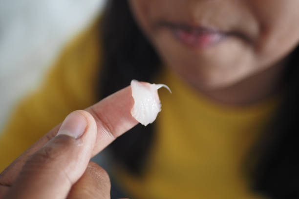 petroleum jelly on finger for child .