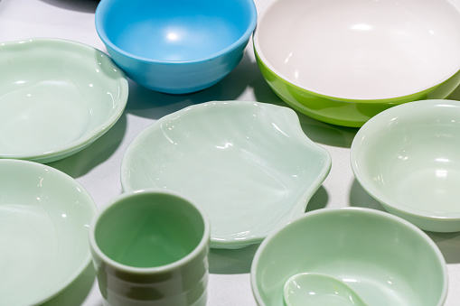 Assorted clean empty bowls and plates for food