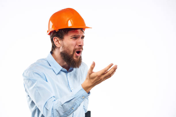 Business man in orange helmet shirt construction security professionals. High quality photo