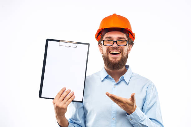istock engineer orange helmet safety professional manual in hand cropped view 1961958058