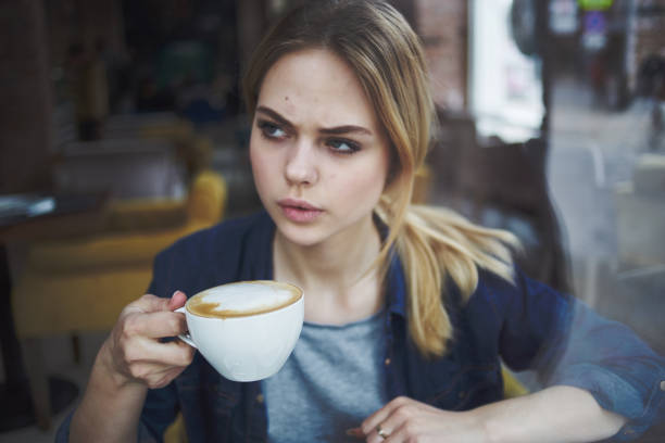 istock woman drinking coffee rest morning snack restaurant 1961962930