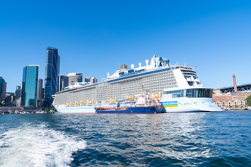 View of Ovation of the Seas cruise ship docked at the Overseas International Terminal at Circular Quay in Sydney Harbour, NSW, on a sunny day