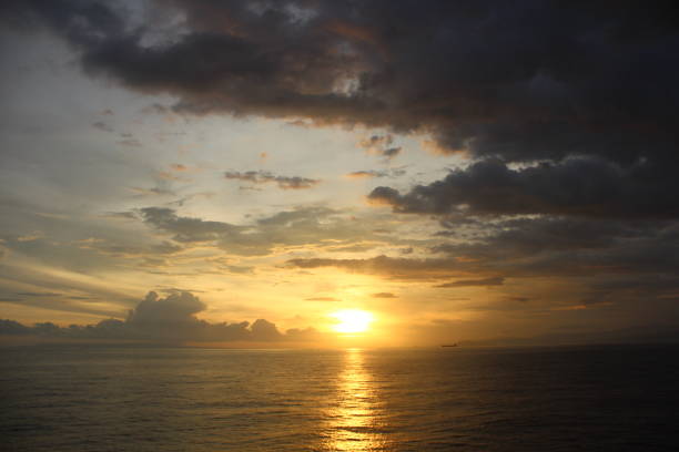 istock Beautiful clouds, calm water and sunset 1962006068