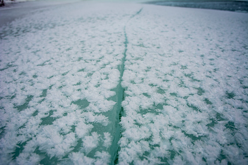 Closeup of icy surface with beautiful snow patterns