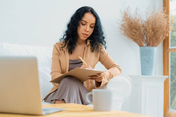 istock African-American woman using laptop computer for crucial work 1962028616