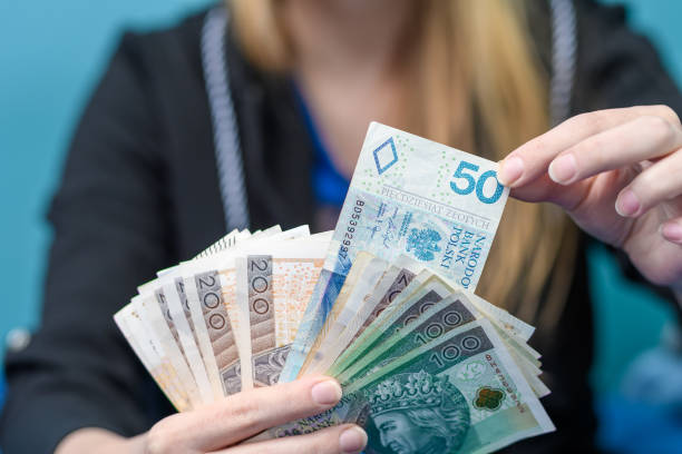 istock The girl is happy with her first salary 1962034907