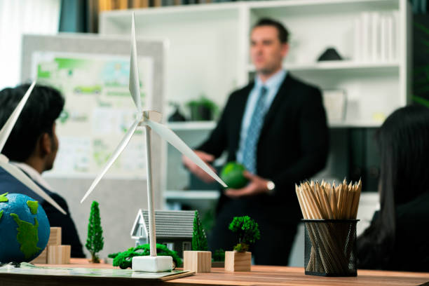 istock EV car model with mockup wind turbine on blurred background meeting. Quaint 1962046936