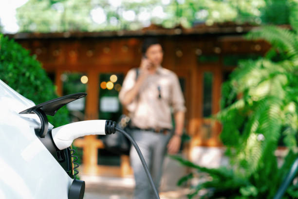 istock Man and sustainable urban commute with EV at cafe. Expedient 1962047965