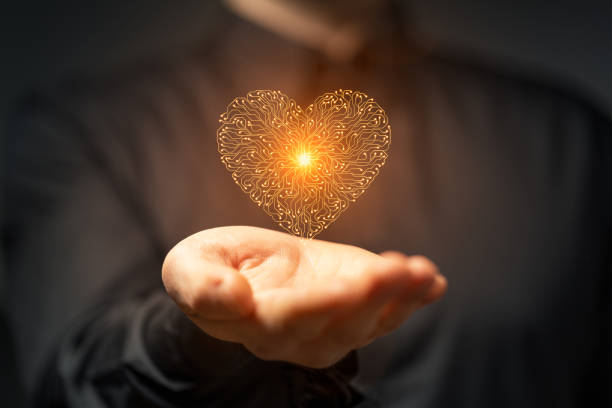 istock Artificial intelligence Circuit board heart symbol in mens hand on dark background 1962137835