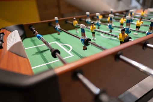 Close-up shot of table football in the hotel entertainment room without people