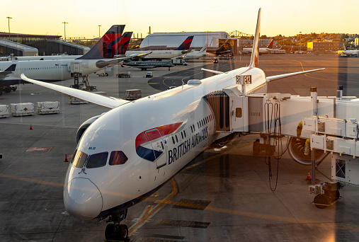 Logan International Airport, Boston Massachusetts, USA - October 2023.  Aircraft on the hard standing and the runway at the airport.