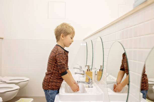 istock Child, washing hands in kindergarden 1962176435
