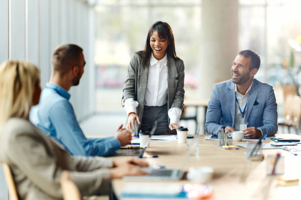istock Cheerful female CEO talking to her team in the office. 1962202244