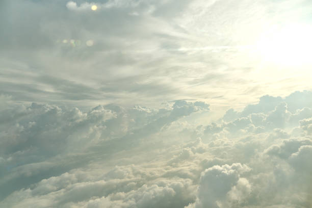 Clouds in the morning at high altitude that move and pass in the sky, illuminated by the sun's rays