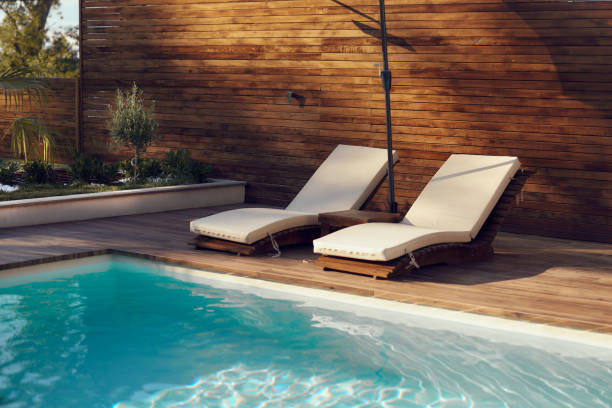 istock Deck chairs by the swimming pool. 1962225374