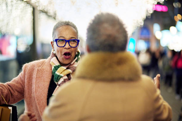 istock Mature female friends meeting while shopping 1962228520