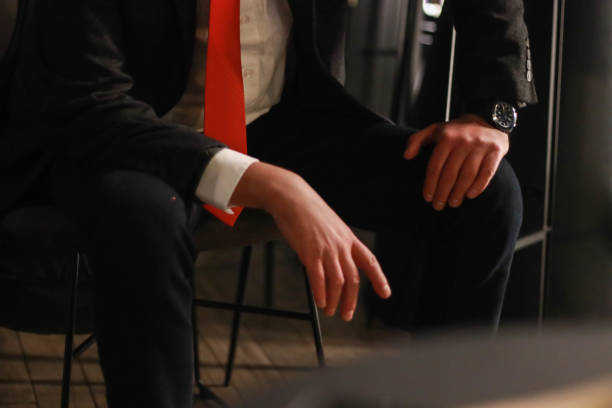 istock Mature gentleman sitting on chair 1962238154