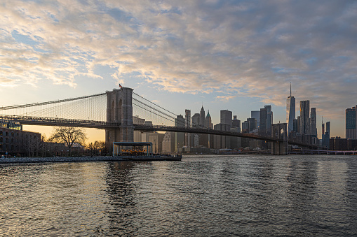 Views of the Brooklyn Bridge in New York at sunset.