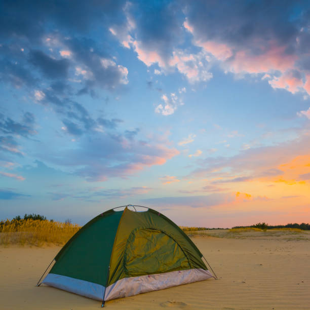 istock closeup small touristic tent among sandy desert at the evening 1962268123