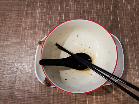 Focus scene on eaten Thai noodle soup in restaurant