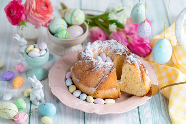 istock Easter yeast cake sprinkled with powdered sugar, decorated with chocolate eggs. 1962344034