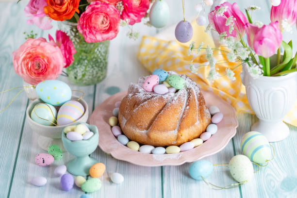 istock Easter yeast cake sprinkled with powdered sugar, decorated with chocolate eggs. 1962344419