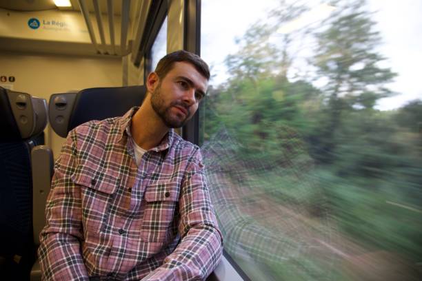 istock Melancholic man traveling by train 1962347665