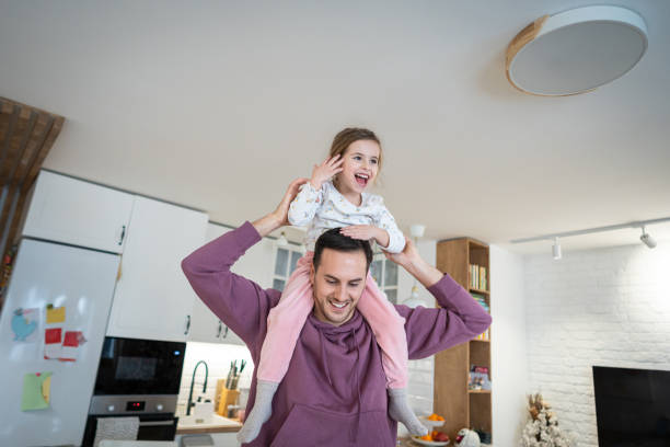 istock Caucasian father and daughter playing at home 1962348726
