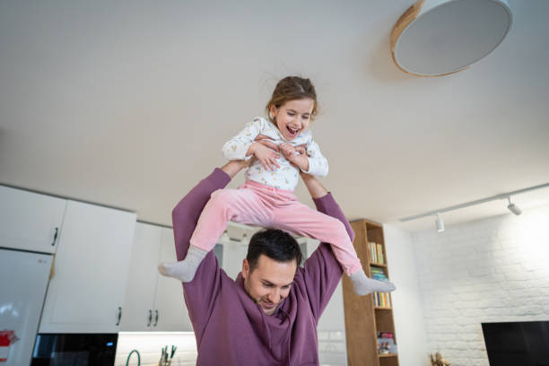istock Caucasian father and daughter playing at home 1962348748