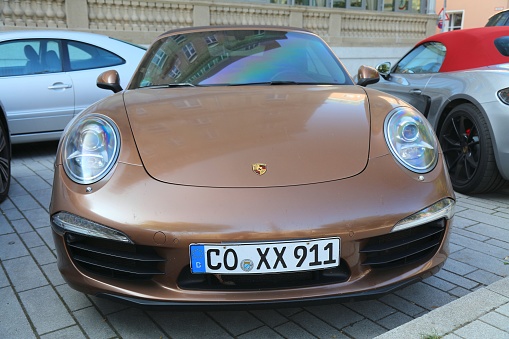 Porsche 991 Carrera luxury sports car parked in Germany. There were 45.8 million cars registered in Germany (as of 2017).