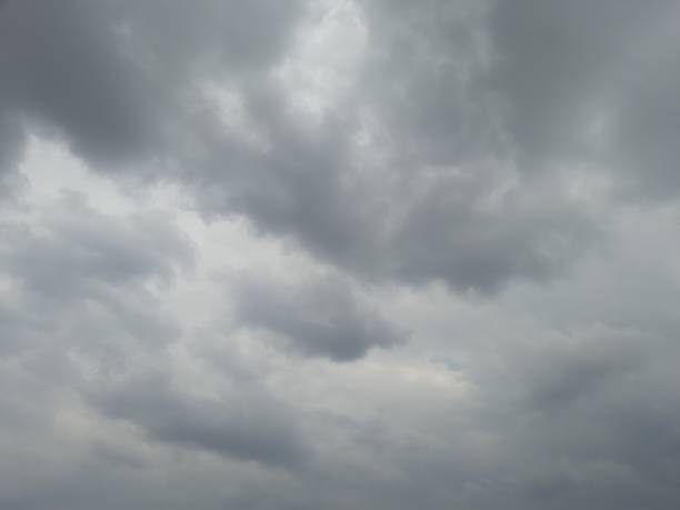 istock Thick gray clouds warning of rain on a winter day, dramatic sky 1962358276