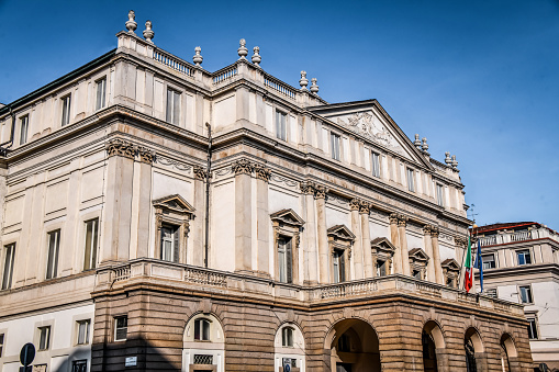 Beautiful Teatro alla Scala at Piazza Della Scala In Milan, Italy. This is the famous La Scala theater, a historic opera house located in Piazza Della Scala in Milan, Italy. The theatre is regarded as one of the leading opera and ballet theatres globally.