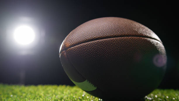 istock stadium lights on a football ball 1962396567
