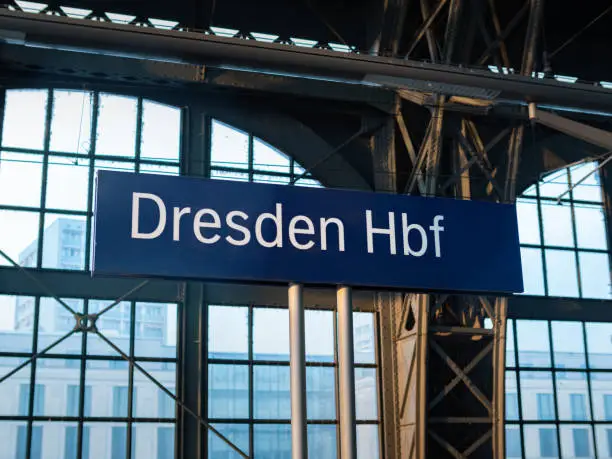 Dresden Hbf sign at the central station. Location name board at the train platform. Travel destination when using the public transportation services.