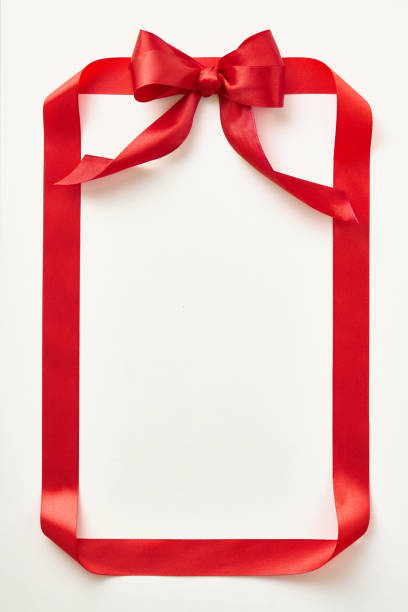 istock Red ribbon shaped like valentine card on light background. Top view. Copy space 1962424313