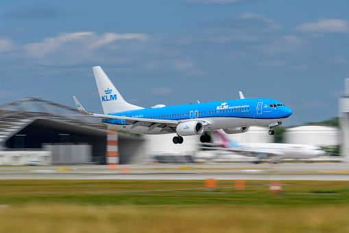 Munich, Germany - July 06. 2023 : KLM Royal Dutch Airlines Boeing 737-9K2 with the aircraft registration PH-BCL during landing on the southern runway 08R of the Munich Airport MUC EDDM