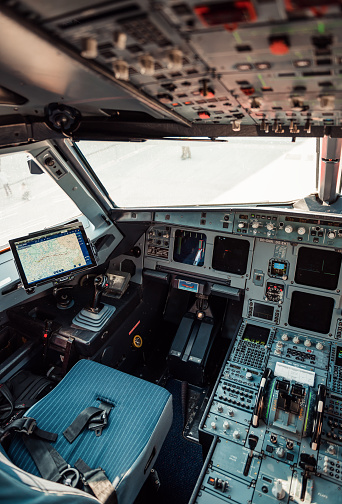 Boryspil, Ukraine - October 17 2018:  airplane cockpit with electronic flying navigation panel, buttons and levers.