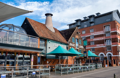‘Isaacs On The Quay’ and the ‘Salthouse Harbour Hotel’ on Wherry Quay, Ipswich Waterfront, Ipswich, Suffolk, Eastern England. Ipswich Waterfront is a popular cultural and historic district surrounding the Neptune Marina, and is home to the University of Suffolk main campus as well as galleries, studios, restaurants and bars.