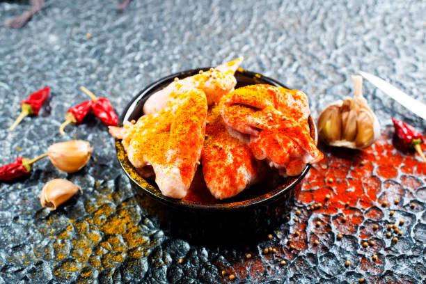 Raw Marinated chicken meat wings and legs for BBQ