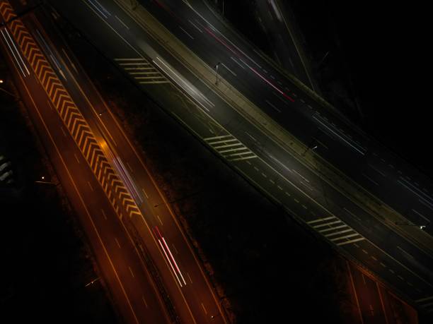 istock Aerial view of a highway at night 1962462368
