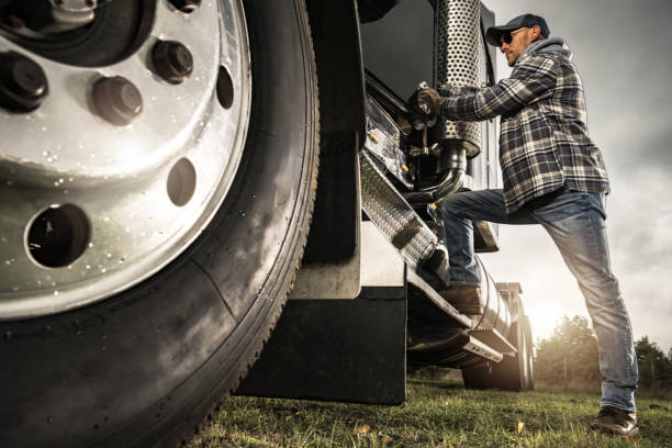 istock Caucasian Semi Truck Driver Getting Inside To His Tractor Cabin 1962465545