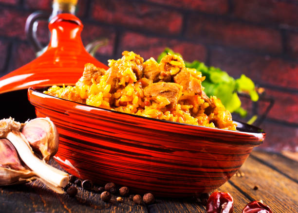 istock Tagine with traditional uzbek pilaf on a table 1962468193