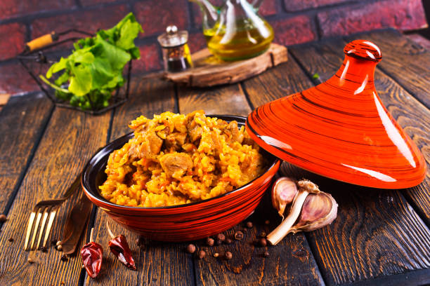 istock Tagine with traditional uzbek pilaf on a table 1962468195