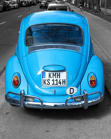 Rear of a light blue VW Volkswagen Beetle parked at the roadside, the number plate, licence plate, has been changed, the initial letters, place abbreviation, KMH do not exist in Germany