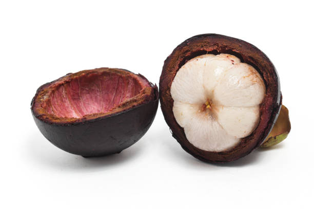 istock Half cut sliced fresh organic mangosteen delicious fruit with peel isolated on white background clipping path 1962473584