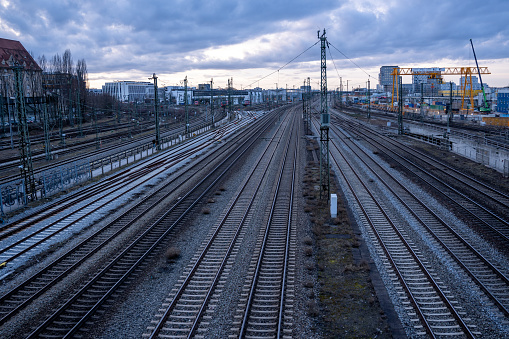 View of the railway tracks from the Donnersberger Bridge in Munich, Germany towards the west at dusk