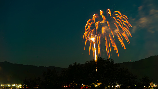 Fireworks bloom in a mountain town