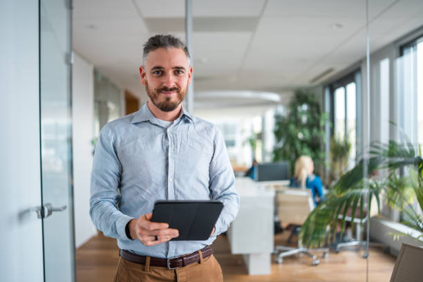 istock Mid Adult Caucasian Male Using Wireless Technology 1962527091